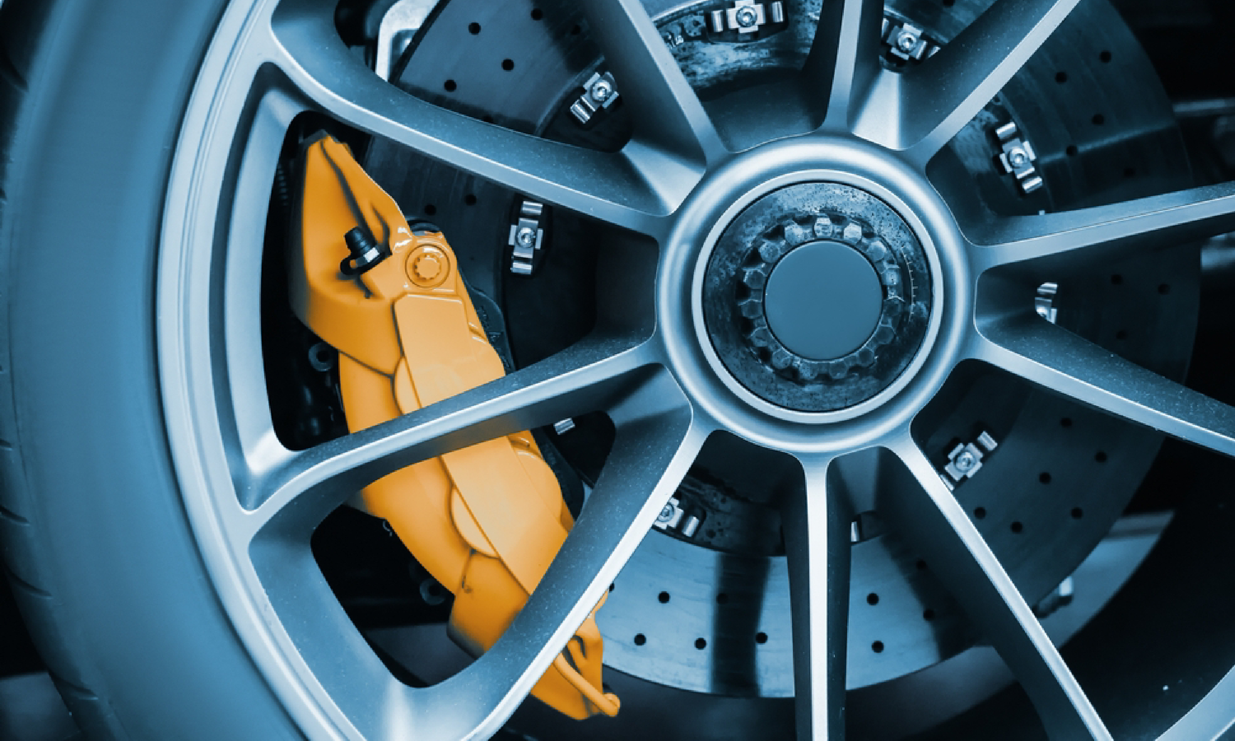 Technician inspecting underbody on lift